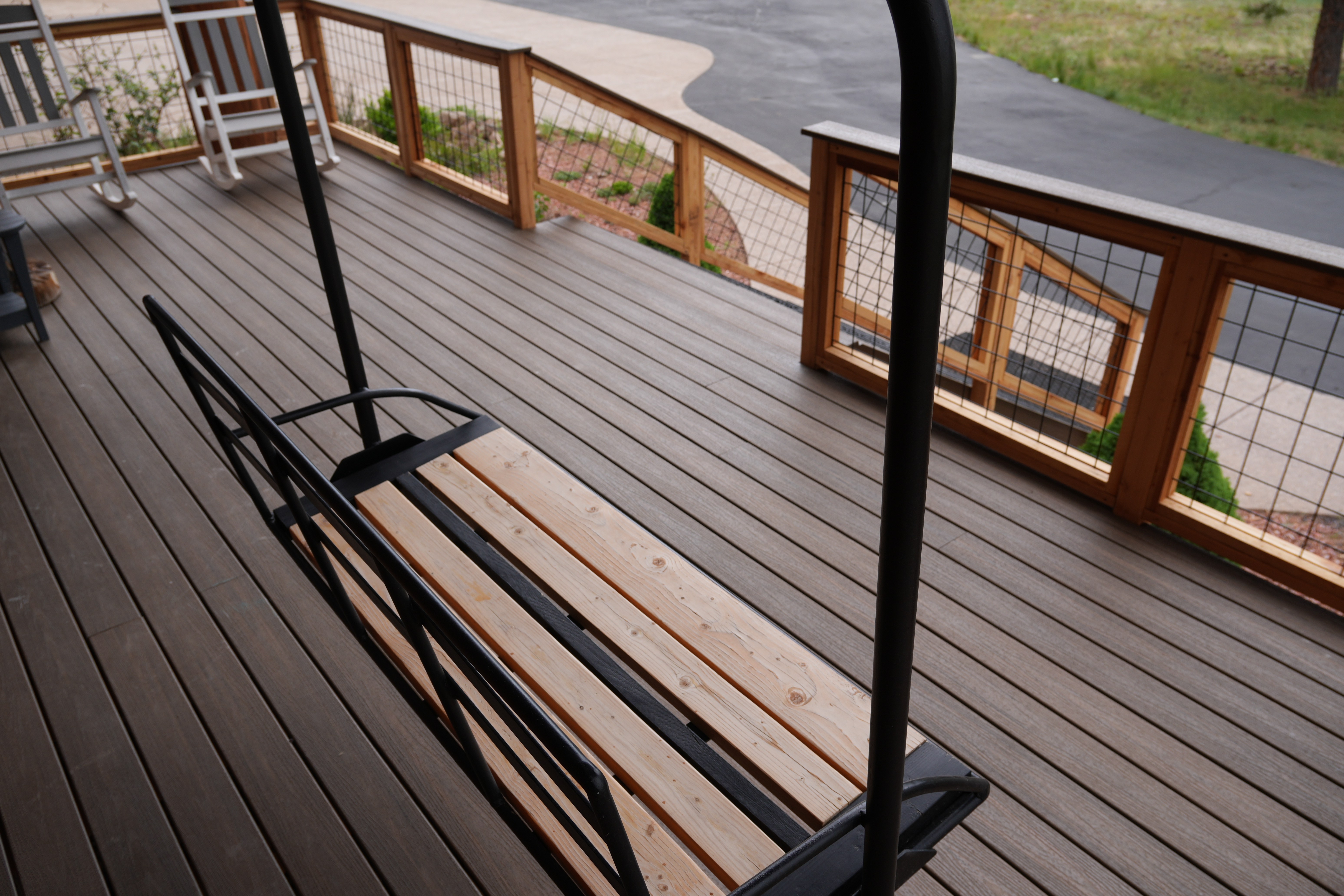 Composite deck with custom bench and railings